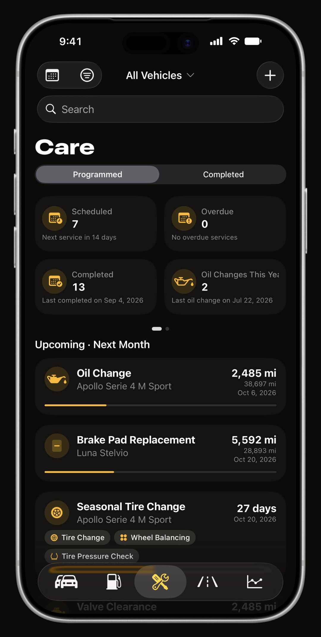 The WrenchTime maintenance tab on iPhone, services grouped by date with the overdue ones first
