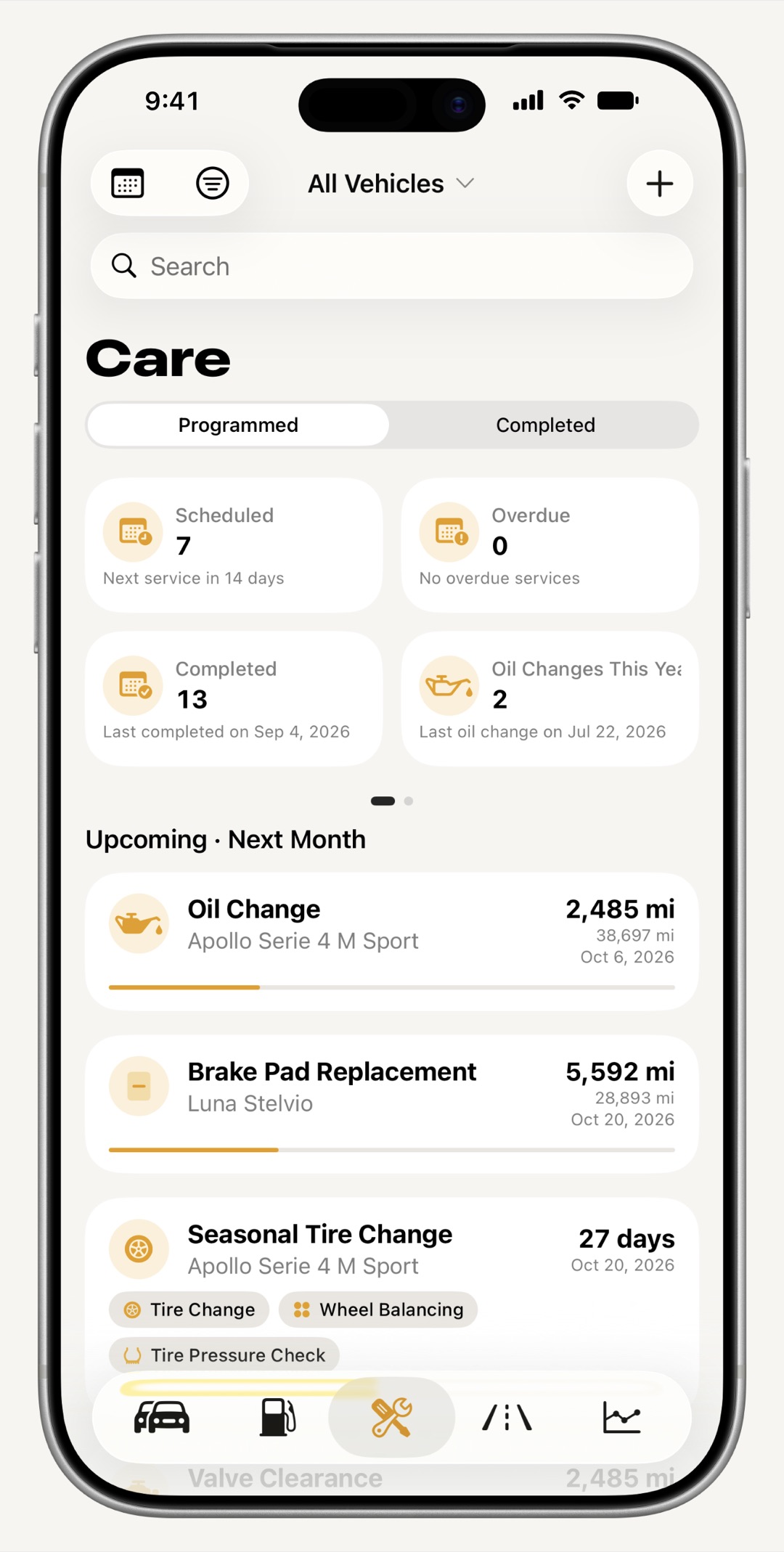 WrenchTime maintenance tab on iPhone showing upcoming and overdue services grouped by date
